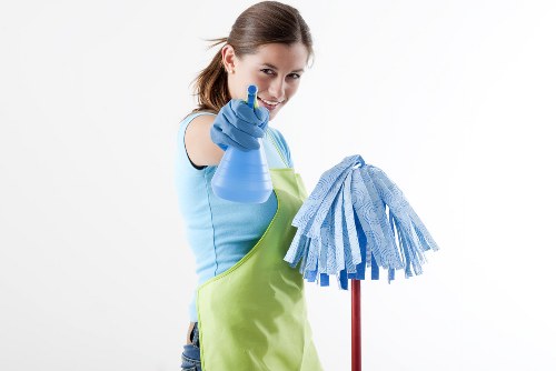 Carpet cleaning professional using safe equipment and protective gear
