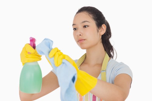 Professional oven cleaner in Finsburypark restoring a dirty kitchen oven