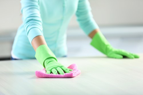 Professional carpet cleaner completing a safety-focused cleaning task